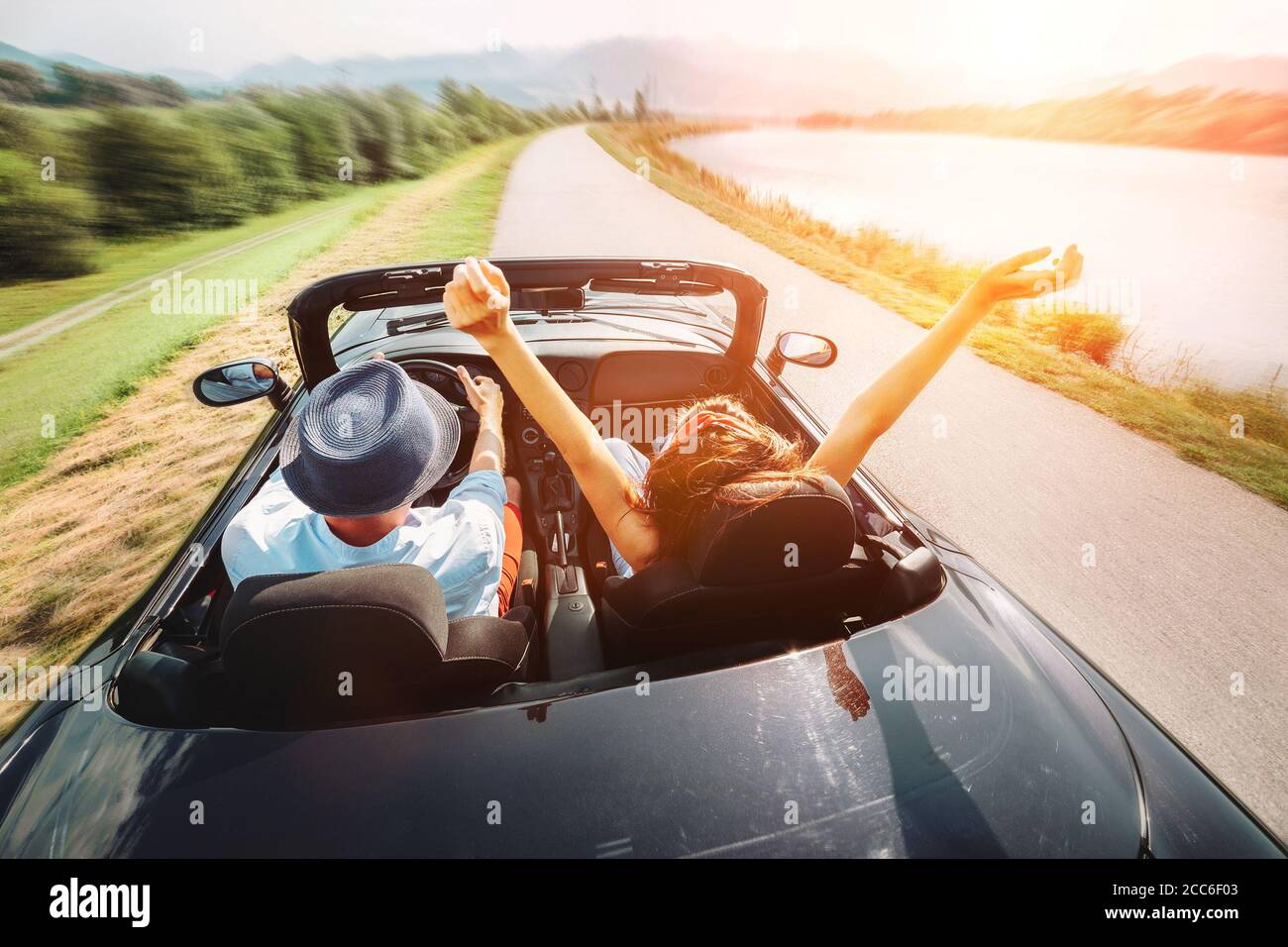 Couple in love ride in cabriolet car Stock Photo - Alamy