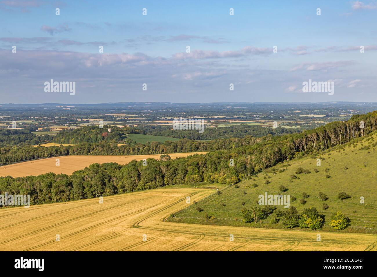 The view out over the South Downs from Firle Beacon, on a sunny summers evening Stock Photo