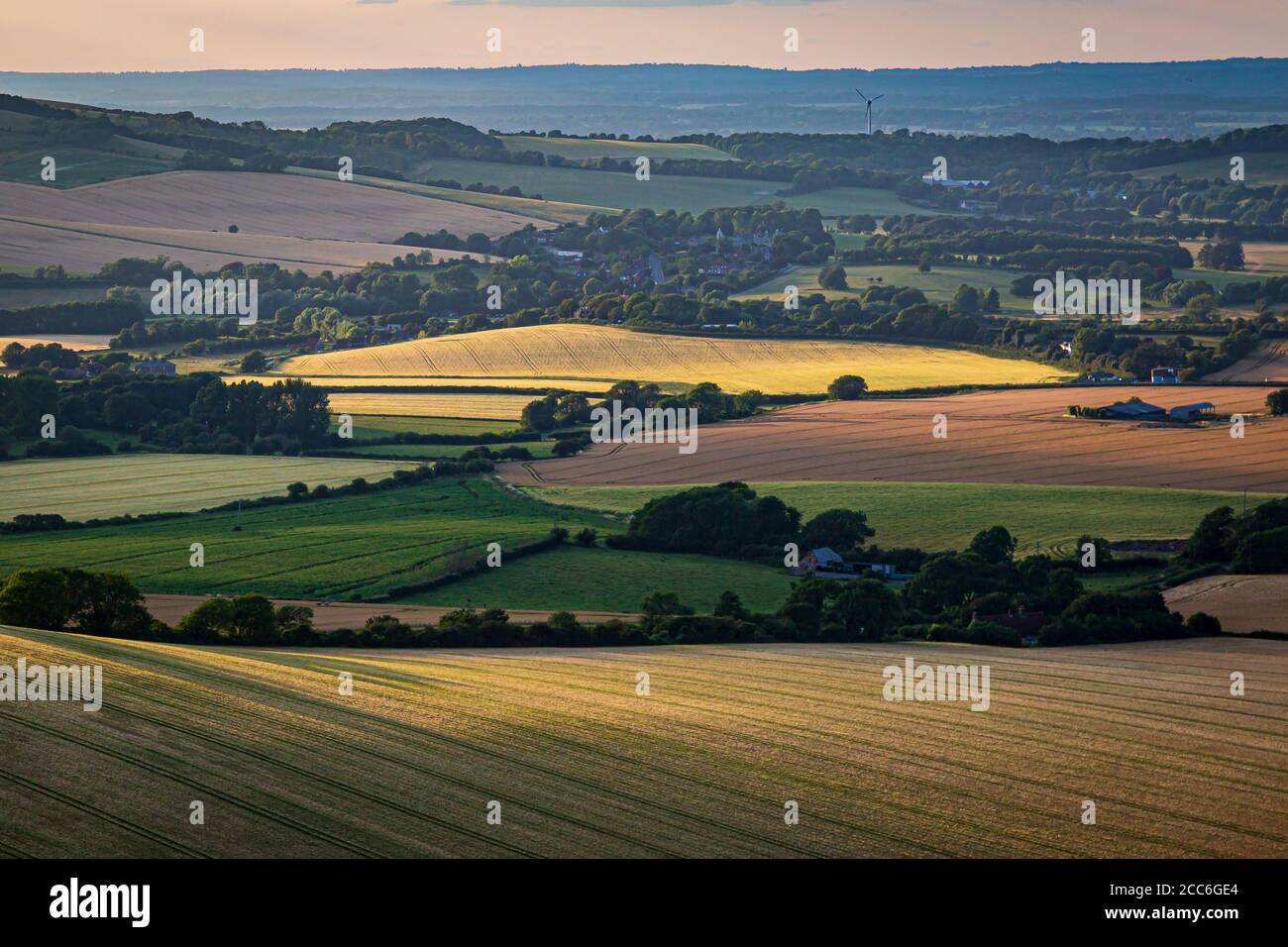 Looking out over a South Downs landscape from Firle Beacon, with evening light Stock Photo