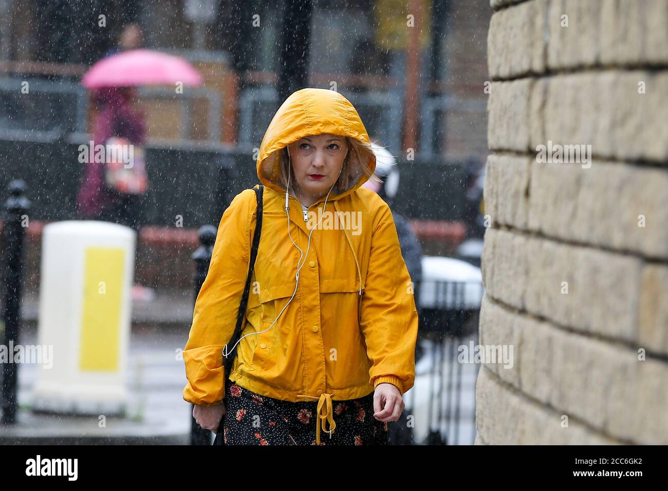 London, UK 19 Aug 2020 - A woman is caught out as Storm Ellen brings heavy rainfall with gusty winds in north London. According to the Met Office warmer weather with highs of 24 degrees celsius is forecasted for the rest of the week. Credit: Dinendra Haria/Alamy Live News Stock Photo