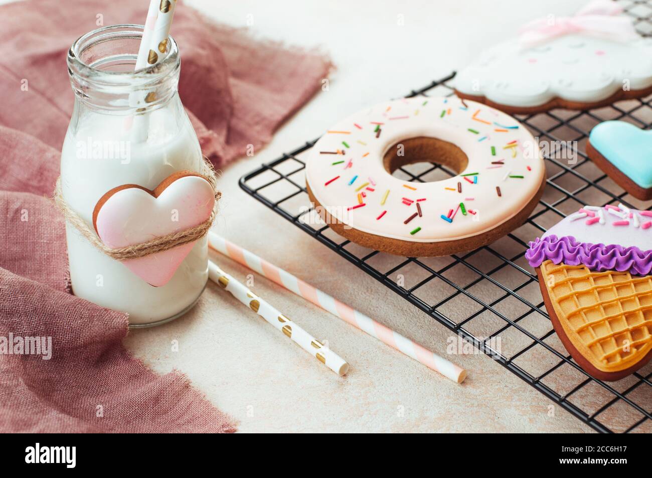 Donut, ice cream cone cookies on the lattice with bottle of milk Stock