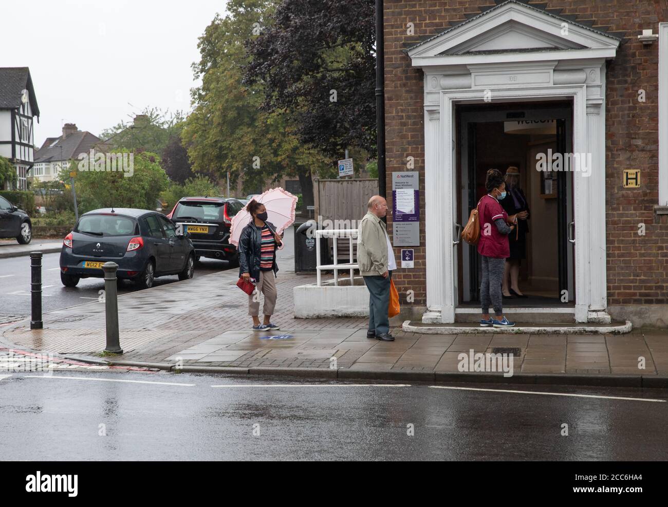 West Wickham, Kent,19th August 2020, Heavy rainfall in West Wickham, Kent. People used umbrellas