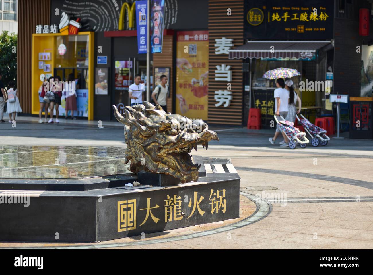 Dragon head sculpture in a bench. Jianghan Road, Wuhan, China Stock Photo
