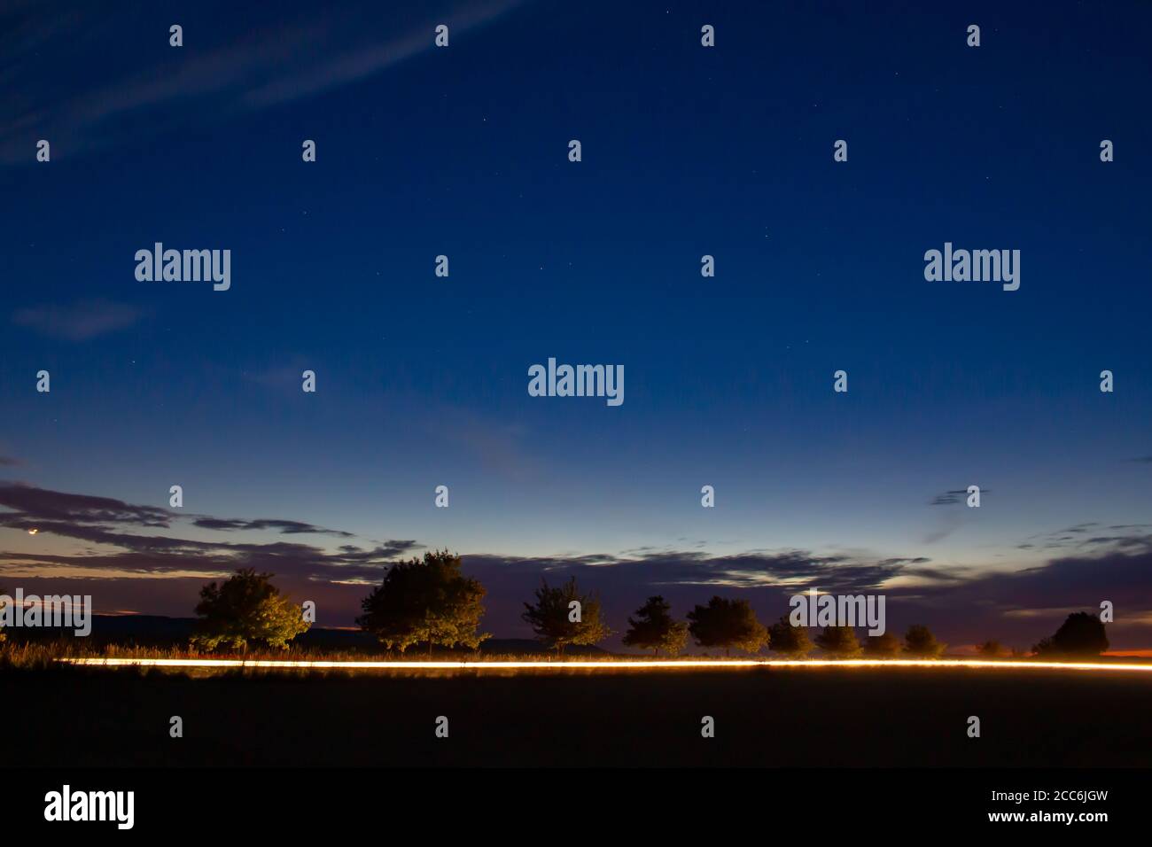 Car trees headlights hi-res stock photography and images - Alamy