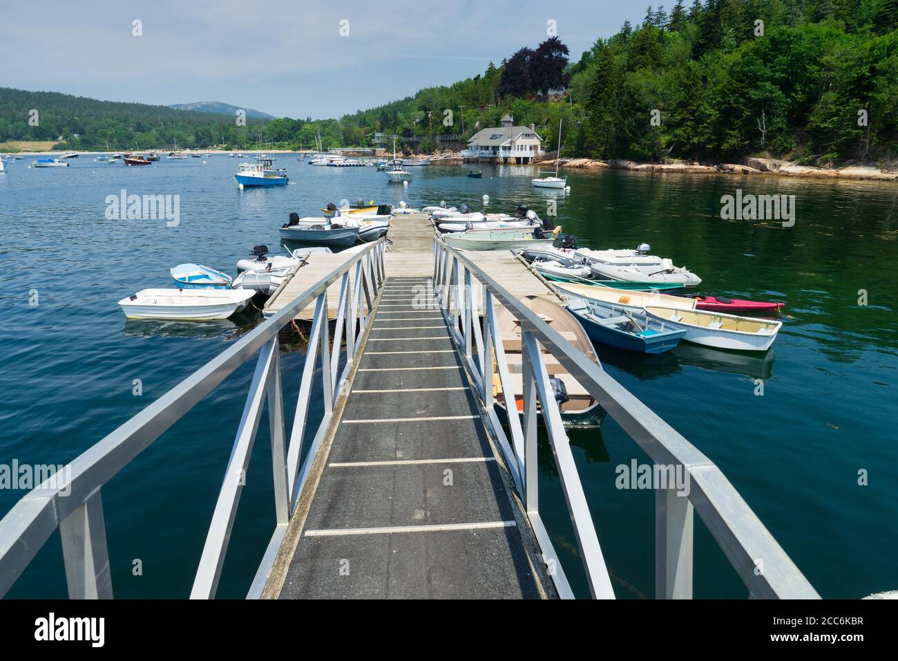 A boat ramp leads to several small boats in Seal Harbor, Maine. Stock Photo