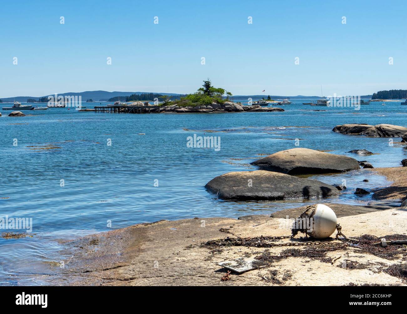 View of boats in the Stonington cove.  The photo was taken from shore looking onto water Stock Photo