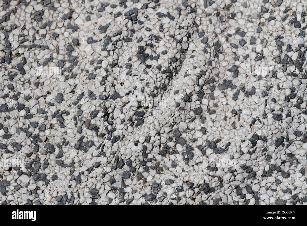 Concrete, plaster, wall covering, flooring made of small pebbles. Concrete  made by mixing tiny black pebbles. Stone floor wall background brick patter  Stock Photo - Alamy