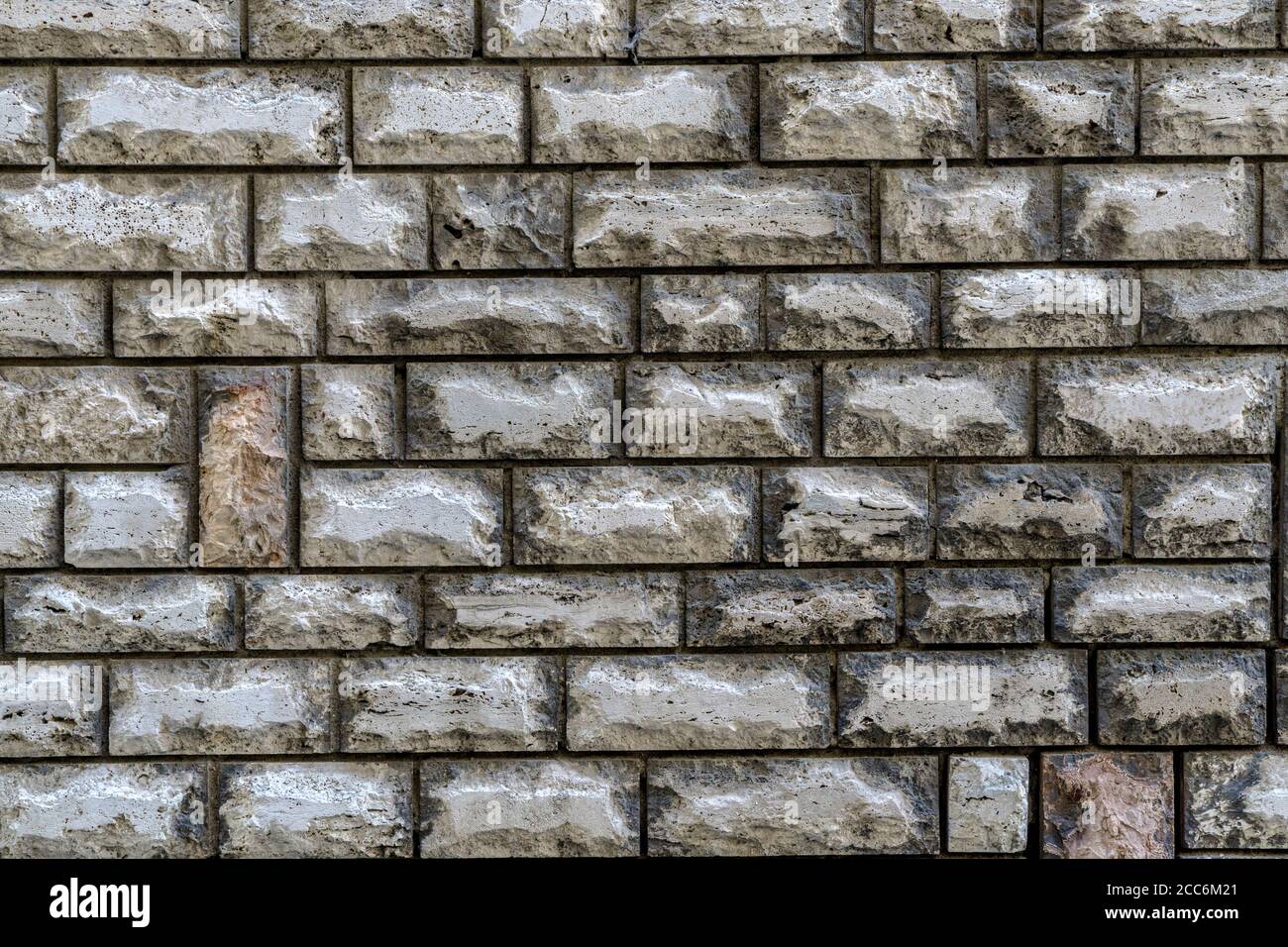 Straight stone wall as Background, Texture, Surface Stock Photo
