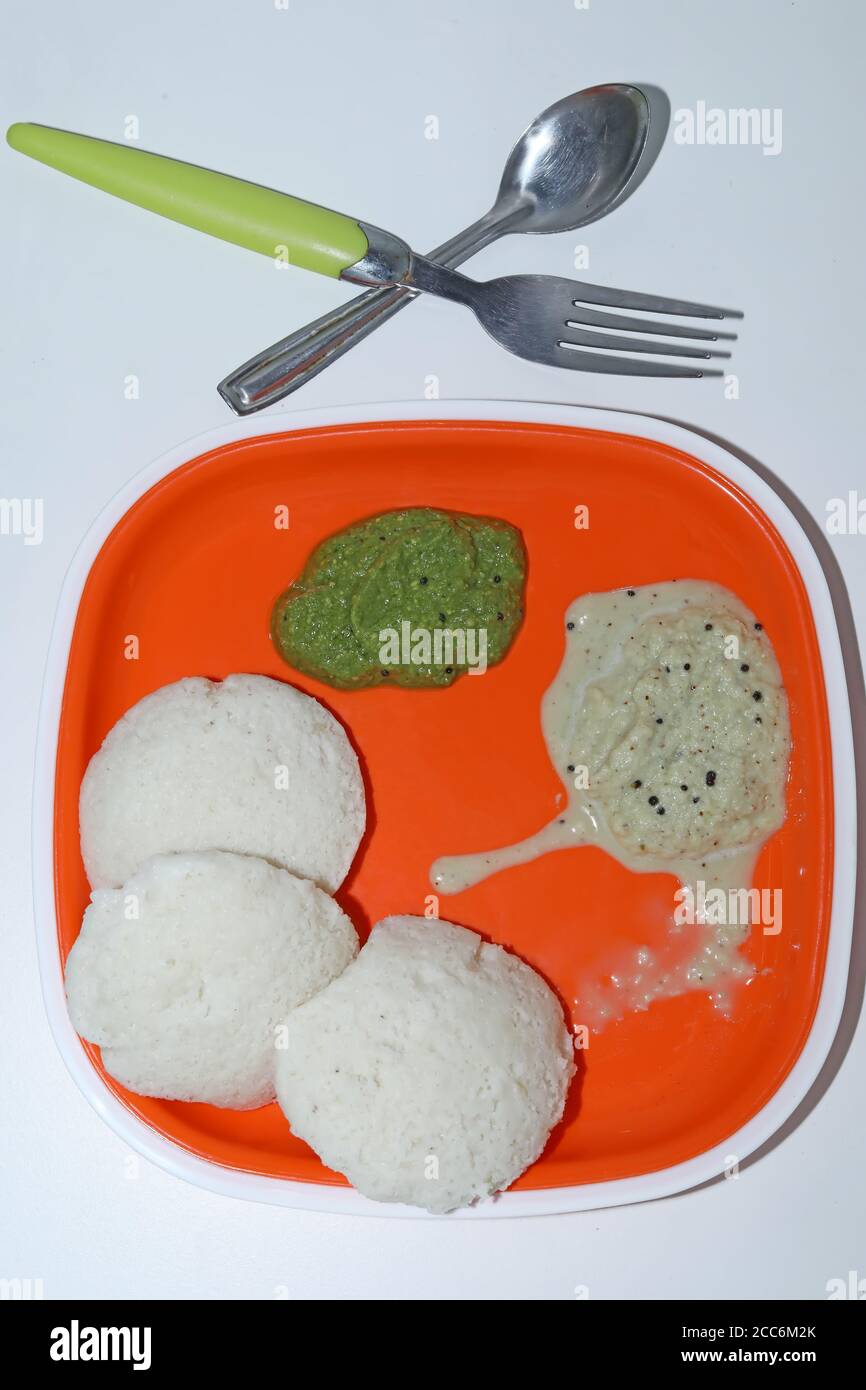 Idli with green & white chutney. Popular South indian breakfasts Stock