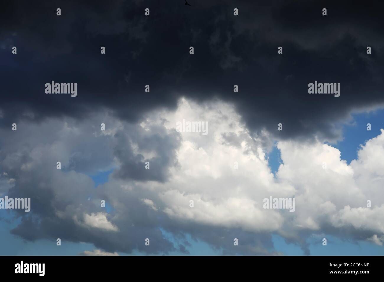 Black cloud and thunderstorm before rainy, Dramatic black cloud and dark sky Stock Photo