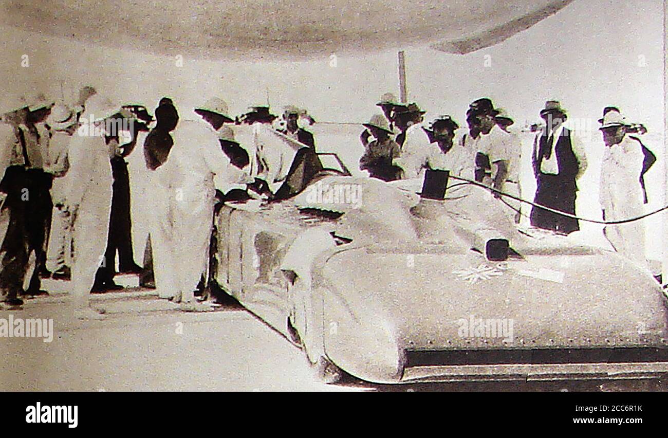 September 1935 - Sir Malcolm Campbell's ( 1885-1948) 'Bluebird' record braking racing car being refuelled at Bonneville Flats, Utah, USA,  where on the 3rd of  September 1935, Campbell became the  first person to drive an automobile over 300 mph. Campbell unsuccessfully  stood for Parliament at the 1935 general election in Deptford as a Conservative Party candidate. He is also said to have had links to the British Union of Fascists and to have once flown a swastika flag from his own private car. Campbell eventually died of natural causes (Stroke in 1948) Stock Photo