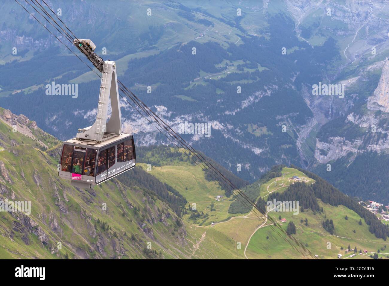 Murren, Switzerland - July 30, 2016 - Tourists taking the cablecar to the top of Schilthorn, a famous sightseeing place with magnificent view of Berne Stock Photo