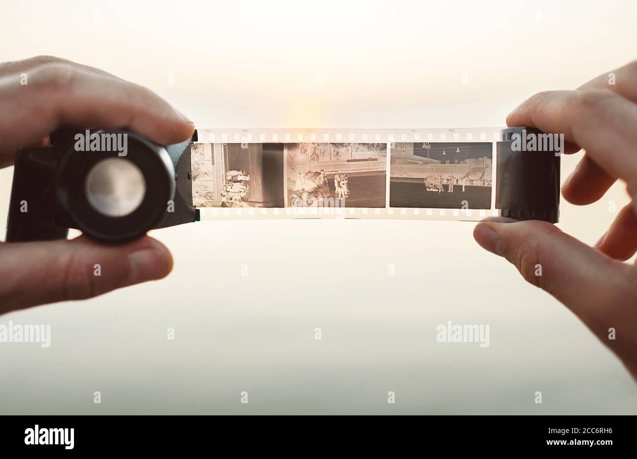 Male hands image using the Old vintage 35mm film Negative Viewer to see