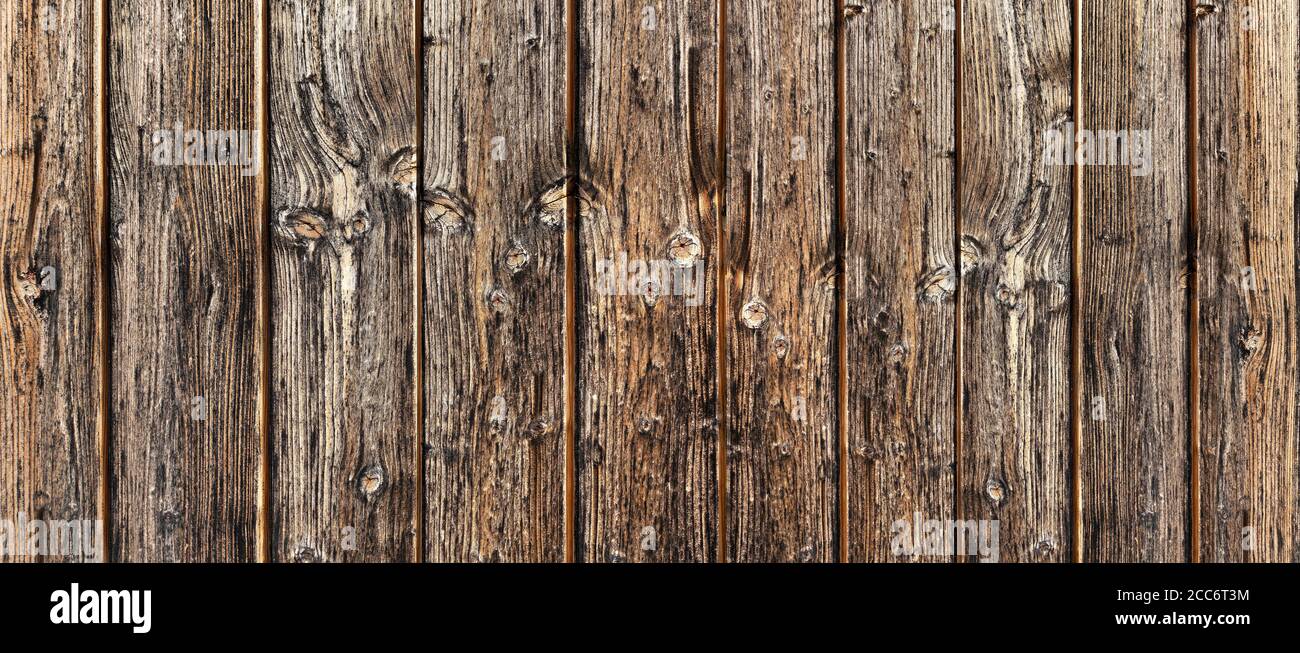Old rustic weathered wooden wall in closeup Stock Photo