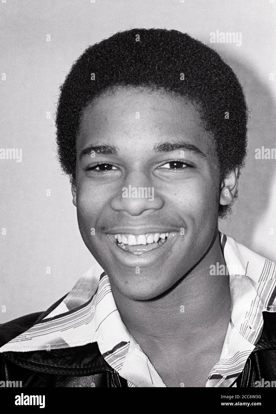1970s 1980s PORTRAIT SMILING AFRICAN-AMERICAN TEENAGE BOY YOUNG MAN LOOKING AT CAMERA - b26020 HAR001 HARS JOY LIFESTYLE HEALTHINESS HOME LIFE COPY SPACE PERSONS MALES TEENAGE BOY CONFIDENCE EXPRESSIONS B&W WIDE EYE CONTACT HAPPINESS HEAD AND SHOULDERS CHEERFUL STYLES AFRICAN-AMERICANS AFRICAN-AMERICAN BLACK ETHNICITY PRIDE SMILES JOYFUL STYLISH TEENAGED EAGER FASHIONS GRIN GROWTH JUVENILES BLACK AND WHITE HAR001 OLD FASHIONED AFRICAN AMERICANS Stock Photo