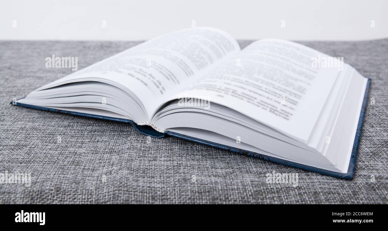 new open book on a gray table close up Stock Photo