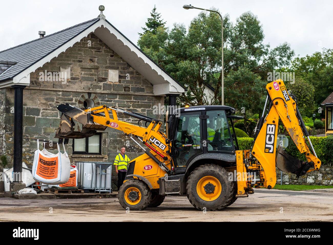 Rosscarbery, West Cork, Ireland. 19th Aug, 2020. Cork County Council manoeuvres sandbags into position in Rosscarbery ahead of Storm Ellen and a Met Éireann red wind warning for County Cork. Rosscarbery was hit badly with floods last weekend. Credit: AG News/Alamy Live News Stock Photo