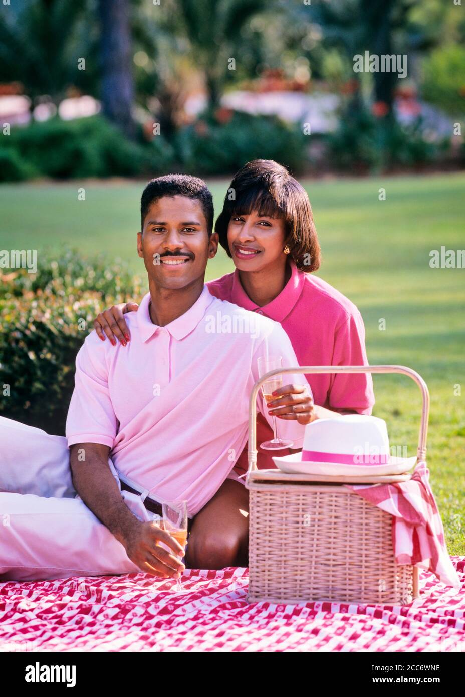 1980s 1990s AFRICAN-AMERICAN COUPLE SITTING LOOKING AT CAMERA ON BLANKET WITH PICNIC BASKET  - kc12203 LAF002 HARS BLANKET STRONG PLEASED JOY LIFESTYLE FEMALES MARRIED RURAL SPOUSE HUSBANDS HEALTHINESS COPY SPACE FRIENDSHIP HALF-LENGTH LADIES PERSONS CARING MALES PARTNER EYE CONTACT DATING HAPPINESS CHEERFUL LEISURE AFRICAN-AMERICANS AFRICAN-AMERICAN RECREATION SMILES CONNECTION JOYFUL STYLISH PERSONAL ATTACHMENT AFFECTION EMOTION TOGETHERNESS WIVES YOUNG ADULT MAN YOUNG ADULT WOMAN OLD FASHIONED AFRICAN AMERICANS Stock Photo