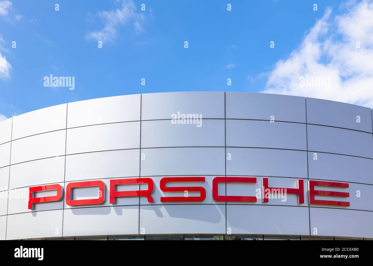 Berlin, Germany - June 12, 2018 - Brand name of Porsche Center in Berlin Adlershof, a new showroom and store for Porsche cars opened in 2017. Stock Photo