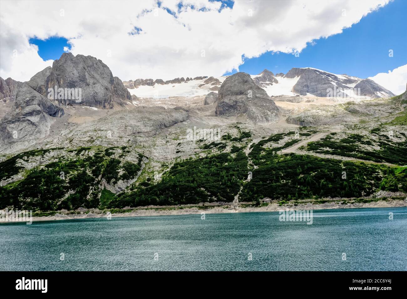 Alpine landscape in the Dolomites, Italy. Glacier Marmolada and Lago di Fedaia. Stock Photo