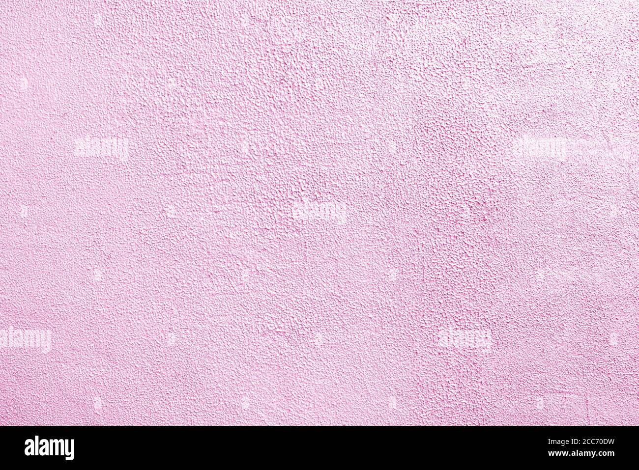 Pink wall of the building. Rough plaster surface. Abstract background. Stock Photo