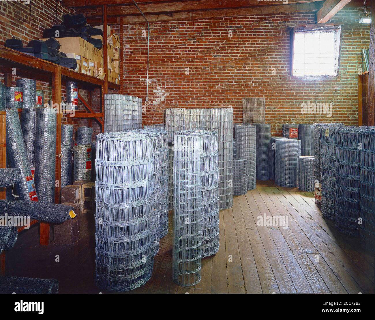 Feed Store interior of fencing materials with sunlight streaming through the window Stock Photo