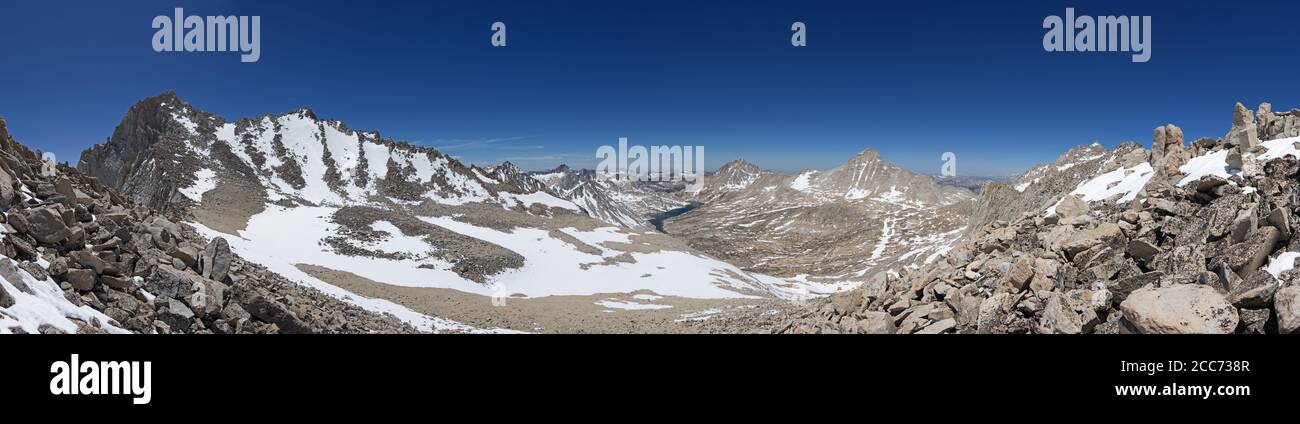 panorama from North Col just north of Cox Col on the ridge between Bear Creek Spire on the left and Mount Dade looking down into Lake Italy basin with Stock Photo