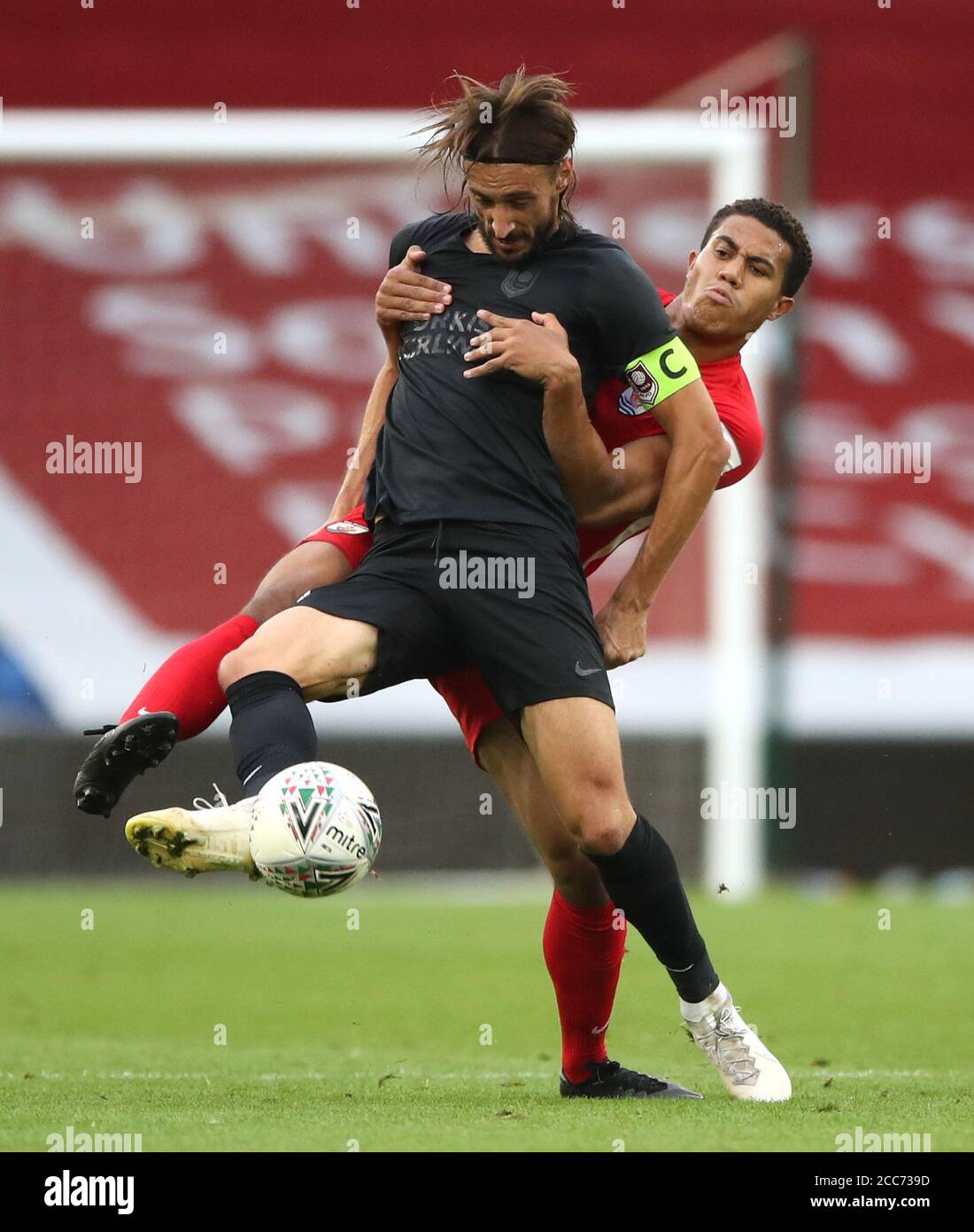 Sarajevo's Mersudin Ahmetovic (left) and Connah's Quay Nomads' Priestley Farquharson battle for the ball during the UEFA Champions League qualifying first round match at The Cardiff City Stadium, Cardiff. Stock Photo