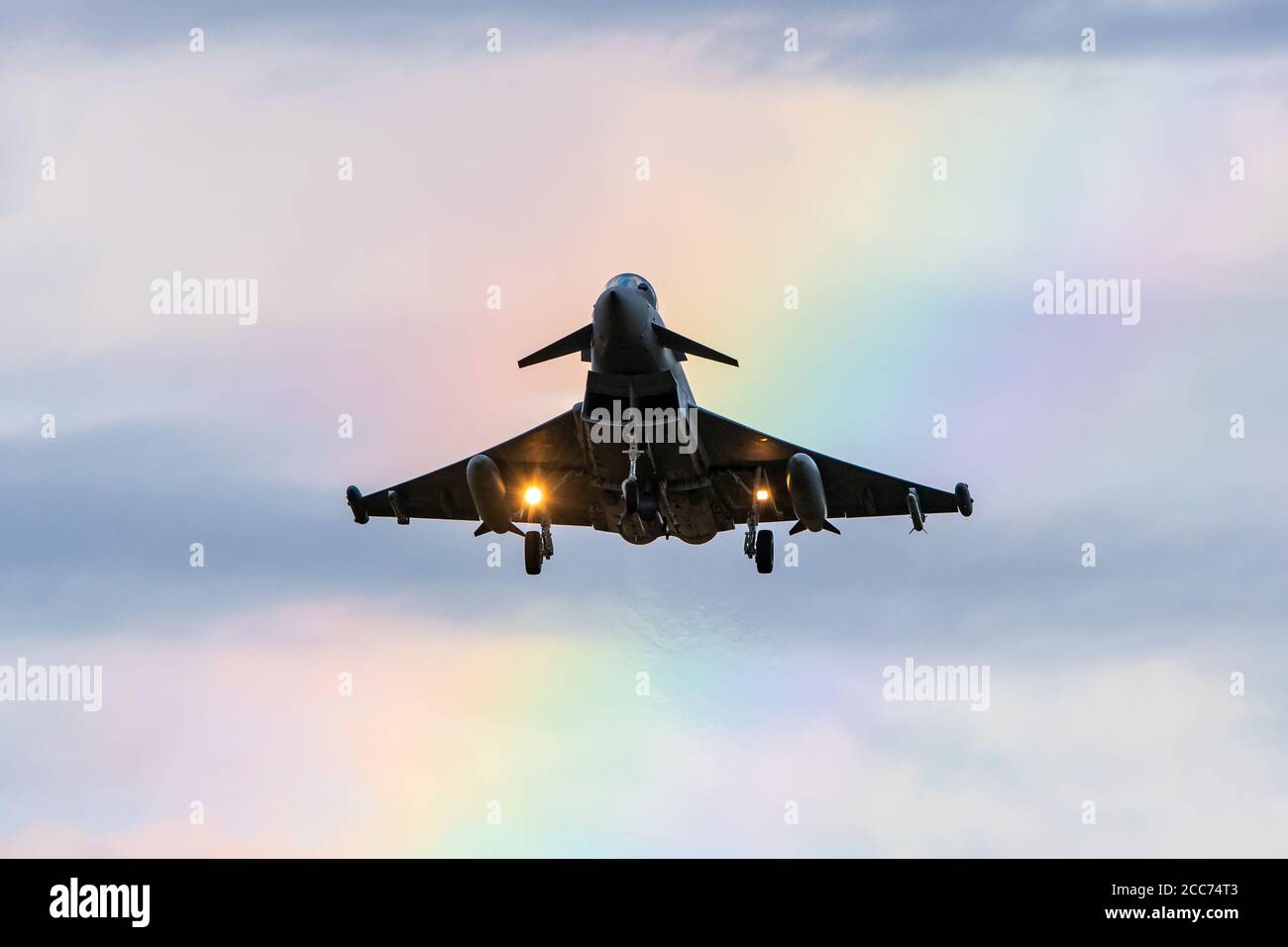 Royal Air Force Eurofighter Typhoon FGR4 descends into RAF Coningsby with a rainbow in the distance. Wednesday 5 August 2020. (Credit: Jon Hobley | MI News) Stock Photo