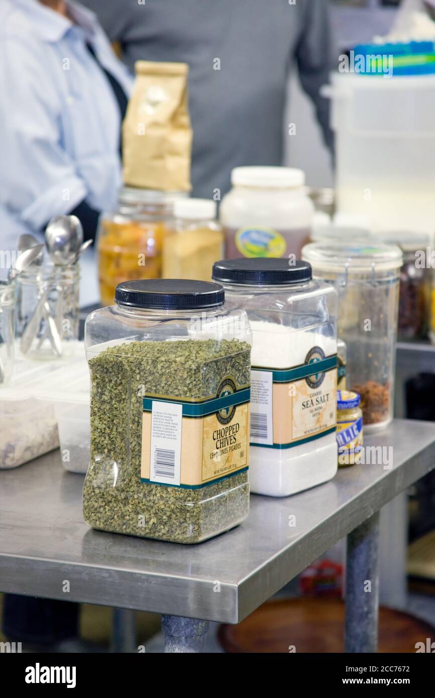 Various spices and herbs used in making chevre cheese, sitting on a