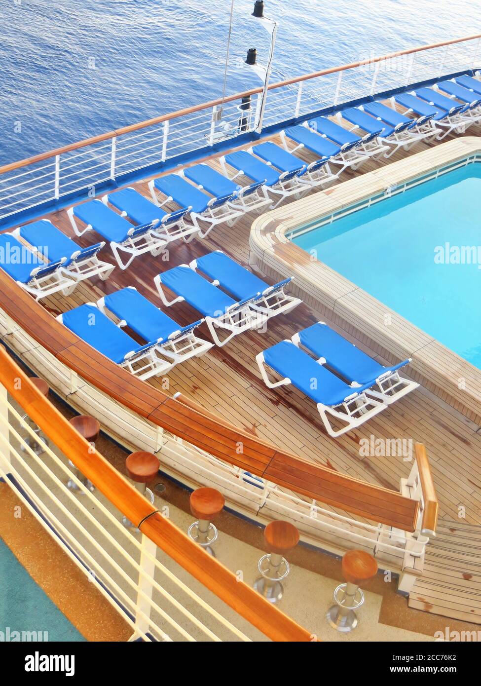 Empty deck chairs and swimming pool on a cruise ship Stock Photo - Alamy