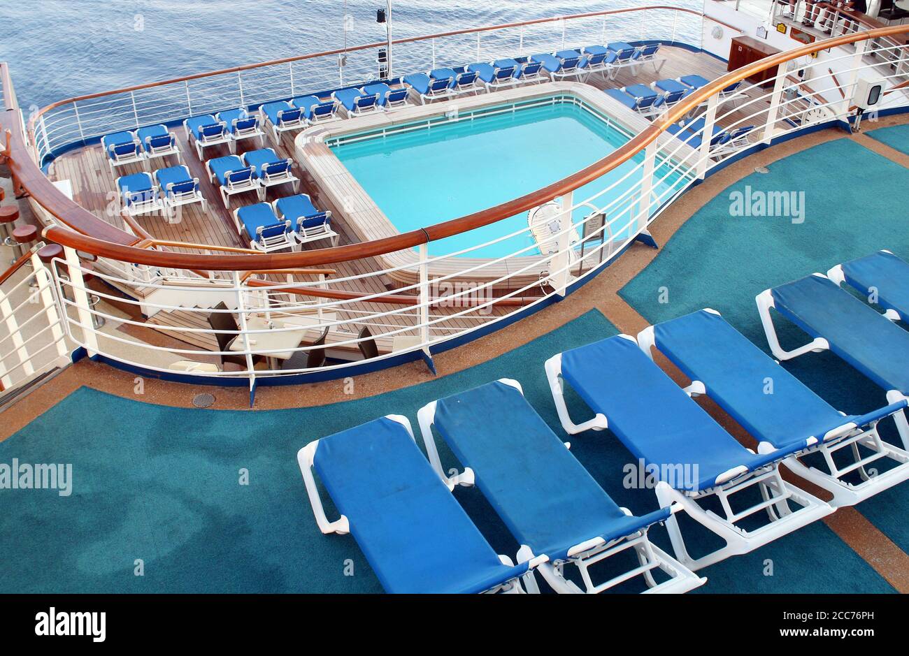 Empty deck chairs and swimming pool on a cruise ship Stock Photo - Alamy
