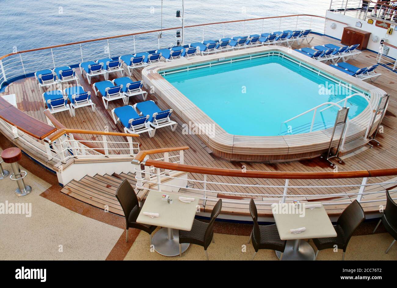 Empty deck chairs and swimming pool on a cruise ship Stock Photo - Alamy