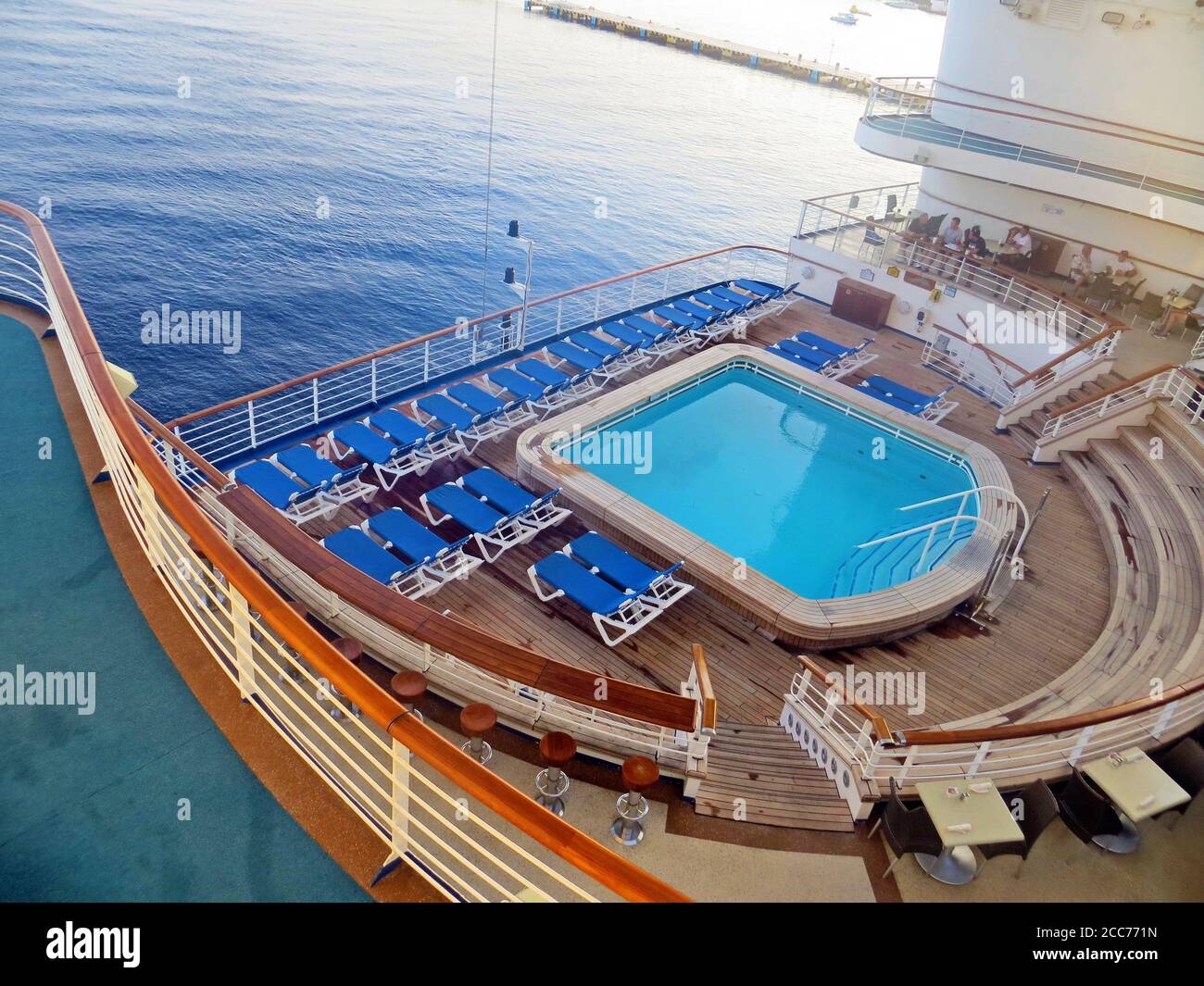 Empty deck chairs and swimming pool on a cruise ship Stock Photo - Alamy
