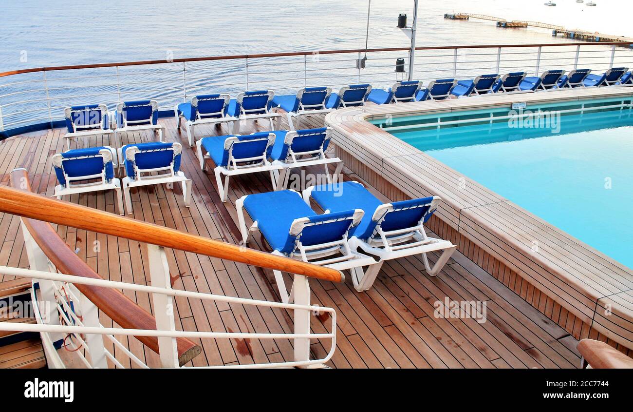 Empty deck chairs and swimming pool on a cruise ship Stock Photo - Alamy