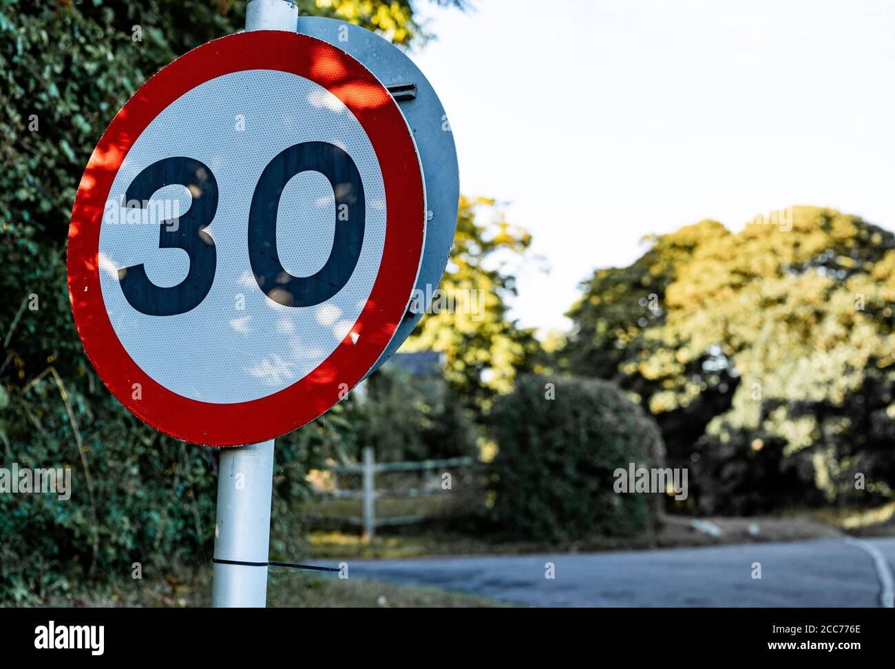 UK 30mph speed limit sign in a rural village, UK Stock Photo