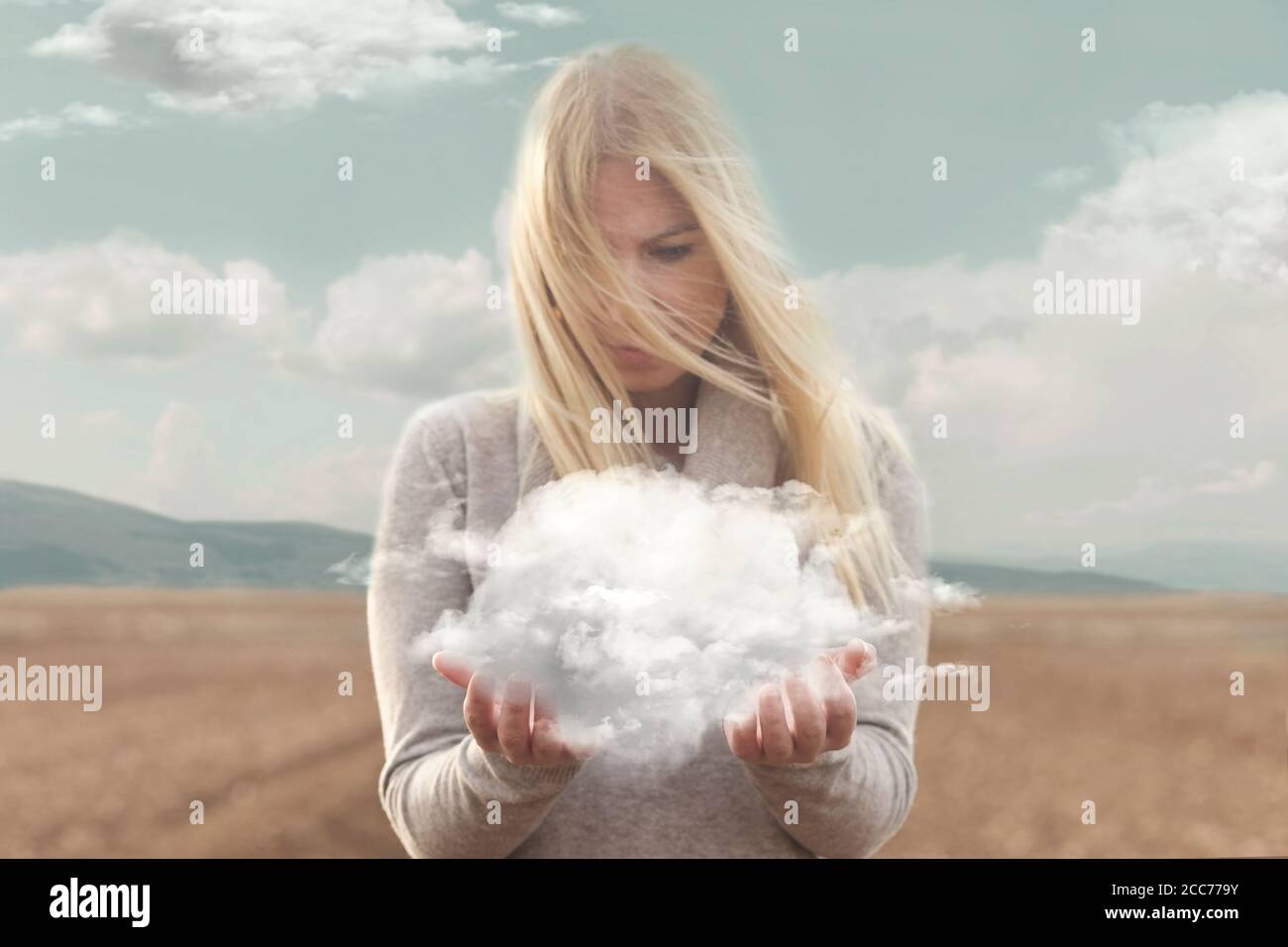 surreal moment , woman holding in her hands a soft cloud Stock Photo ...