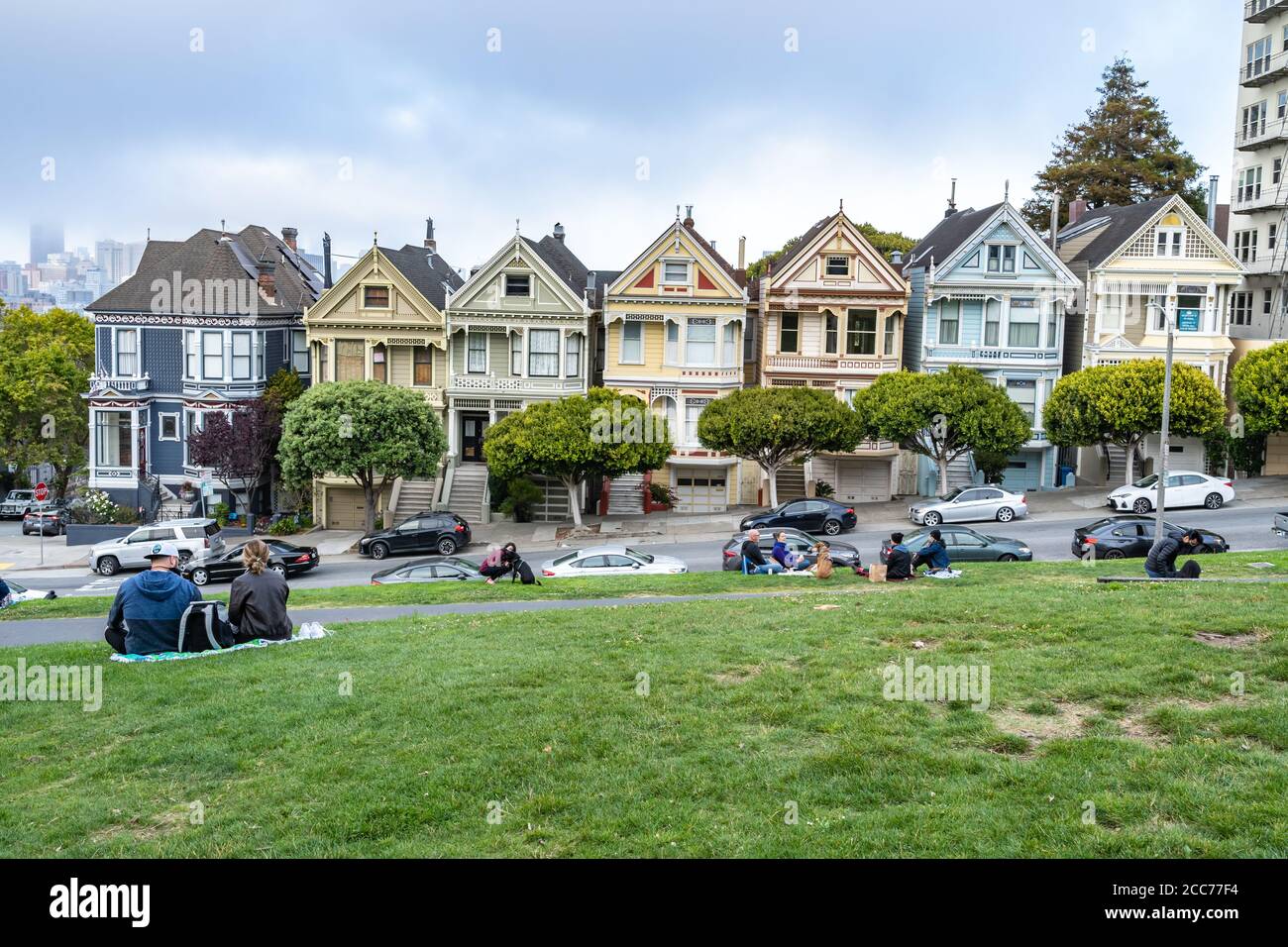 Social distancing at Alamo Square park across from the painted ladies Victorian homes in San Francisco, CA Stock Photo