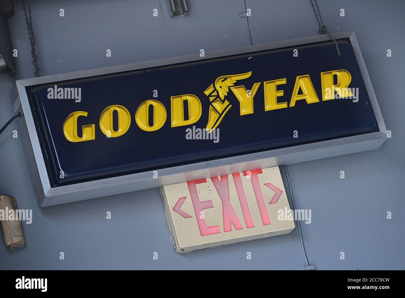 New York City, USA. 19th Aug, 2020. A Goodyear sign hangs inside an auto repair shop in the New York City borough of Queens, in New York, NY, August 19, 2020. President Donald Trump called for a boycott of Goodyear tires after it was reported that the company has banned the wearing of any politically affiliated slogans, including “MAGA” hats. (Anthony Behar/Sipa USA) Credit: Sipa USA/Alamy Live News Stock Photo