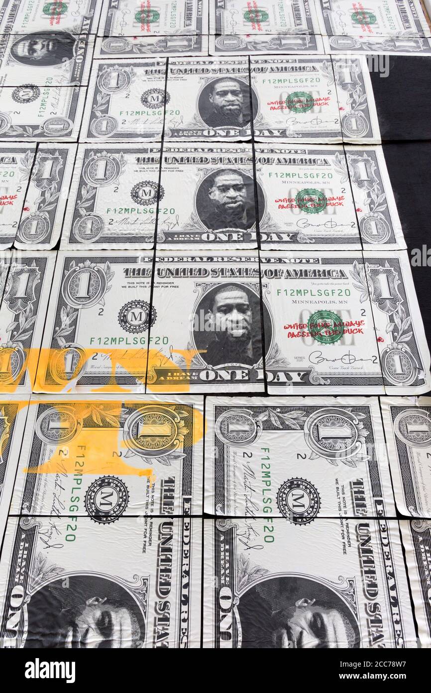 George Floyd portrait on a series of larger-than-life US one dollar bills on a boarded-up store on Hennepin Avenue in Minneapolis, Minnesota.  The dol Stock Photo