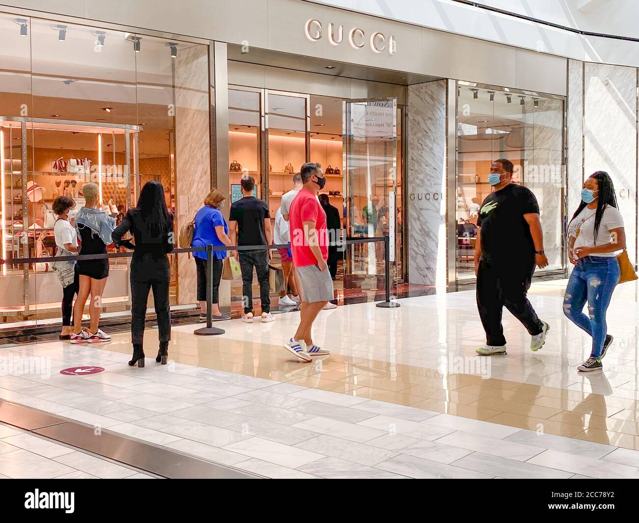 Shoppers in masks wait in line at the Gucci store in the King of Prussia  Mall located near Philadelphia, PA - Social distancing shopping Stock Photo  - Alamy