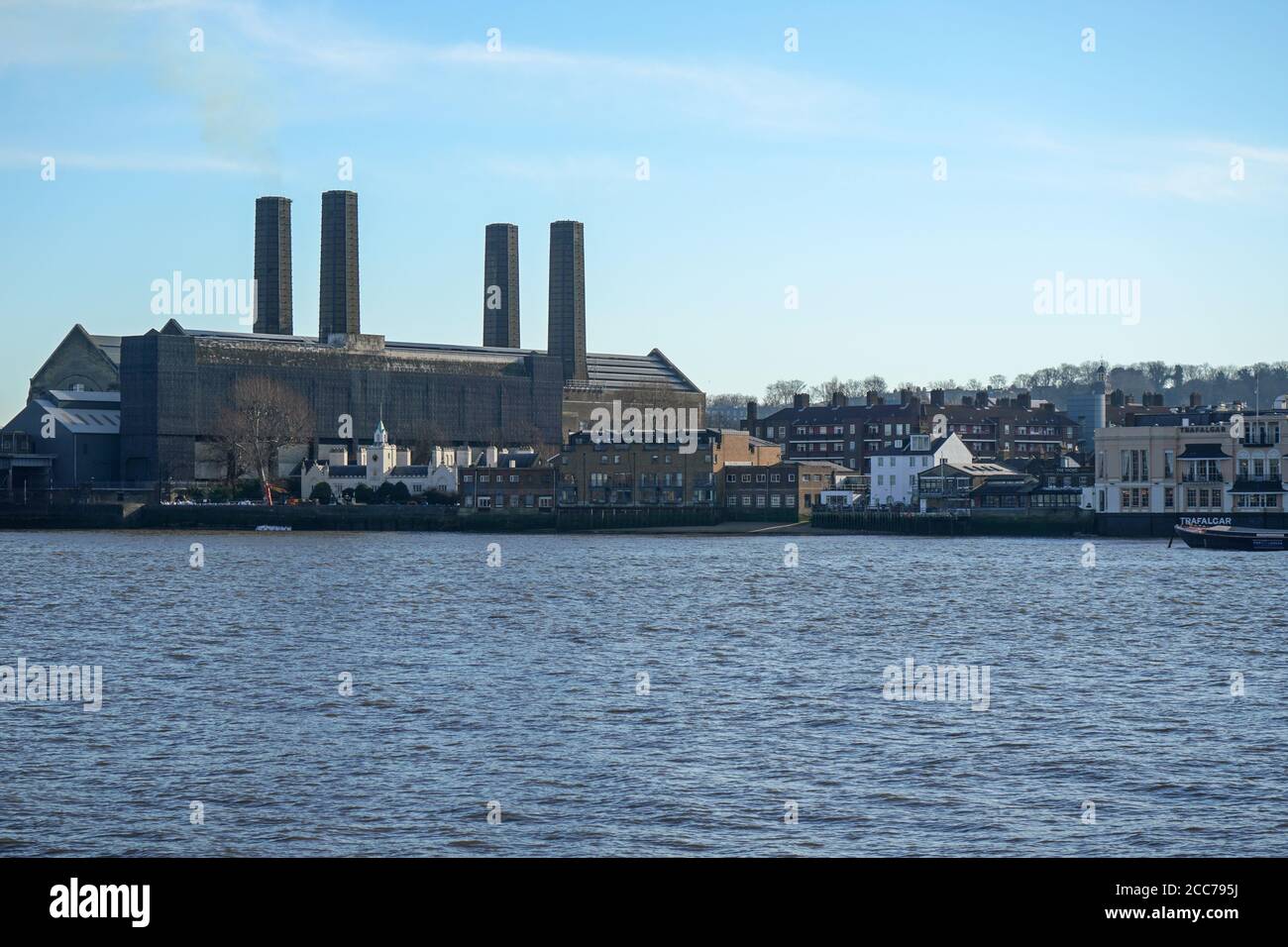 London, United Kingdom - February 03, 2019: South side of river Thames panorama in Greenwich borough, with Trinity Hospital building on left, photogra Stock Photo