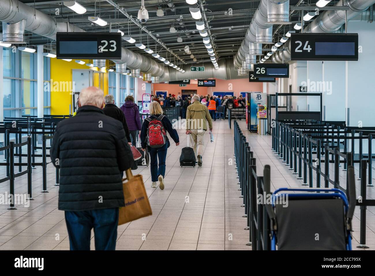 London, United Kingdom - February 05, 2019: Passengers walking in departure hall building to gate desk for their flight, at Luton Airport. LTN is 5th Stock Photo