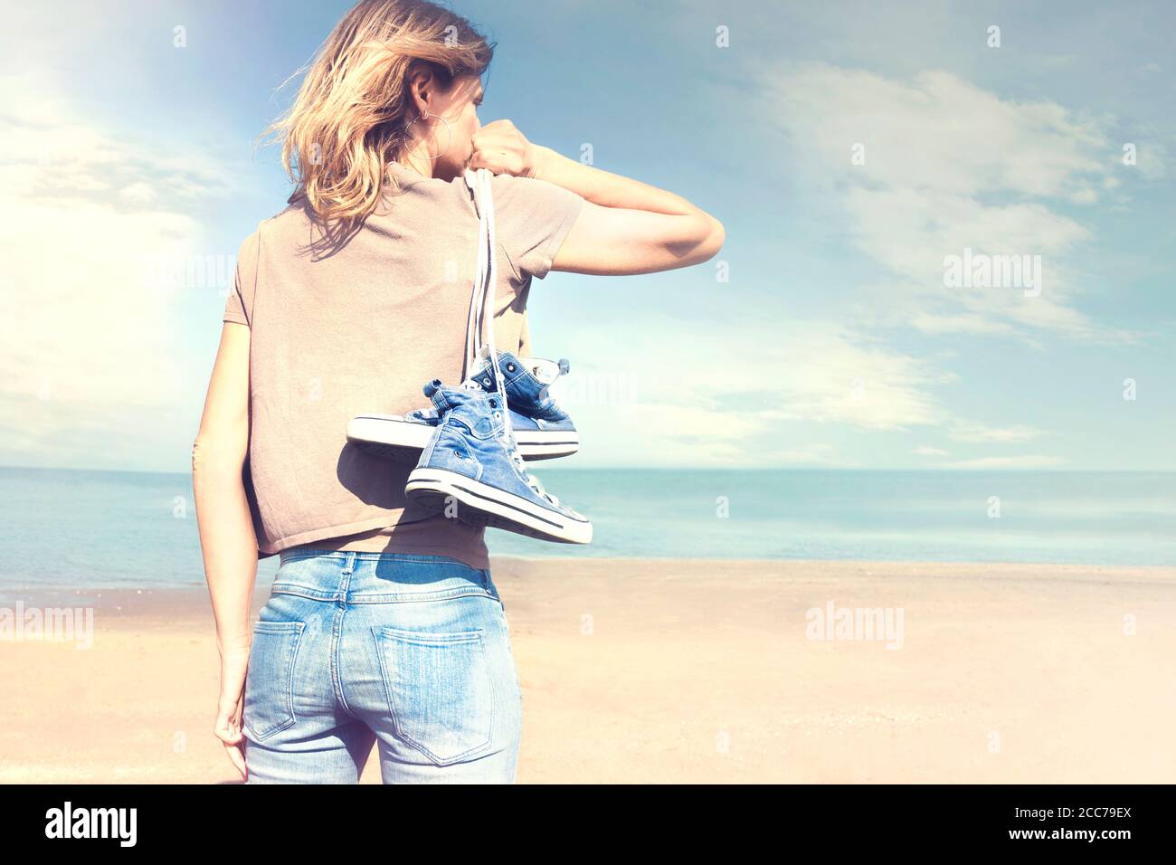 Woman walking barefoot street hi-res stock photography and images - Alamy