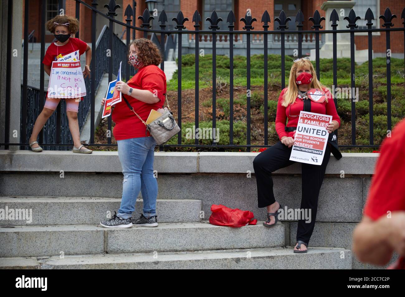 Boston, Massachusetts, U.S.A. 19th Aug, 2020. Massachuetts teachers protest the state's reopening of schools in front of the State House in Boston, MA on August 19, 2020. More than 100 teachers gathered in front of the State House to protest in person learning, and demand the 2020-21 school year be full remote learning due to COVID-19, Corona Virus. Credit: Allison Dinner/ZUMA Wire/Alamy Live News Stock Photo