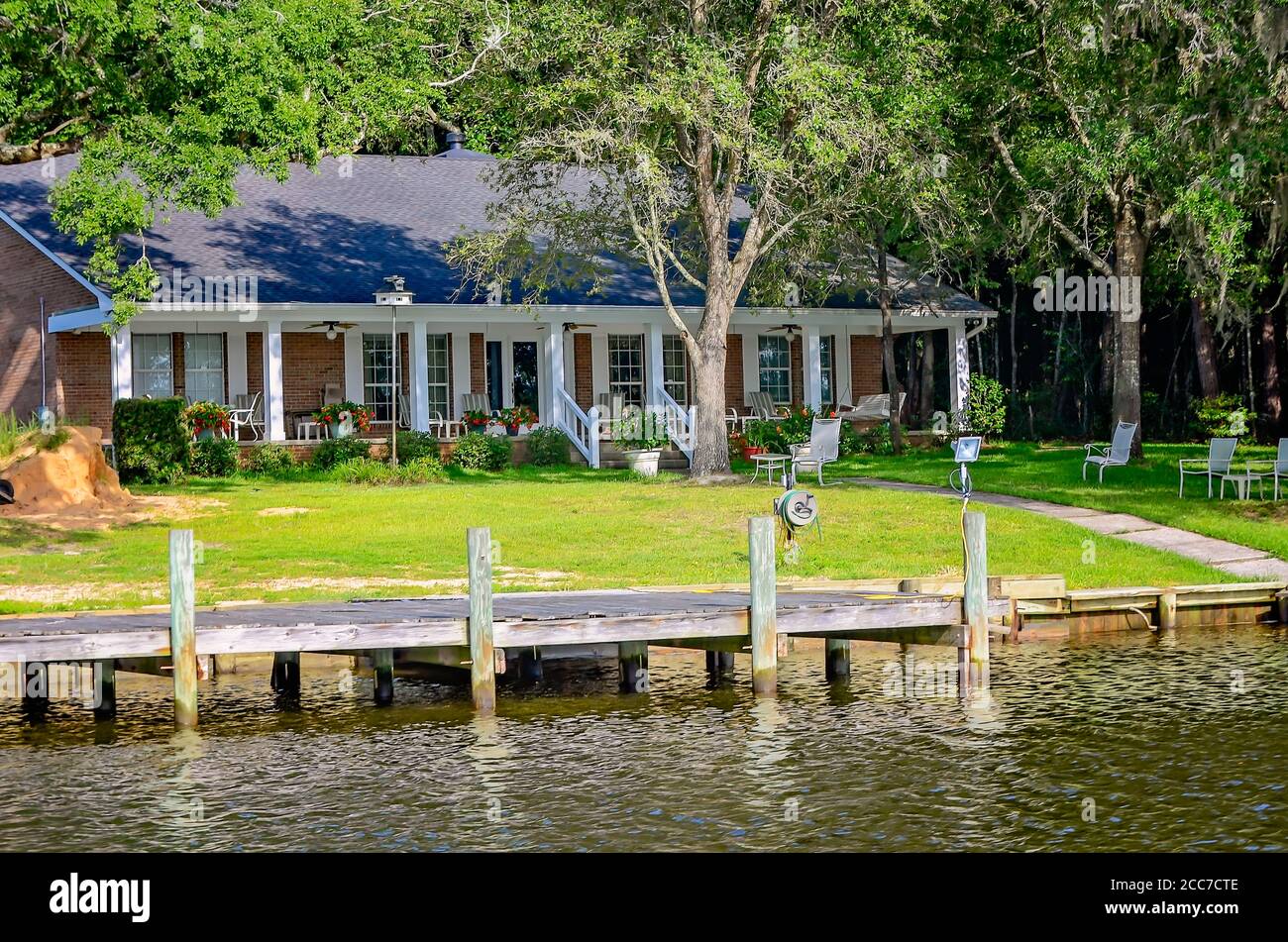 A typical brick house is built on Fowl River, July 6, 2019, in Coden
