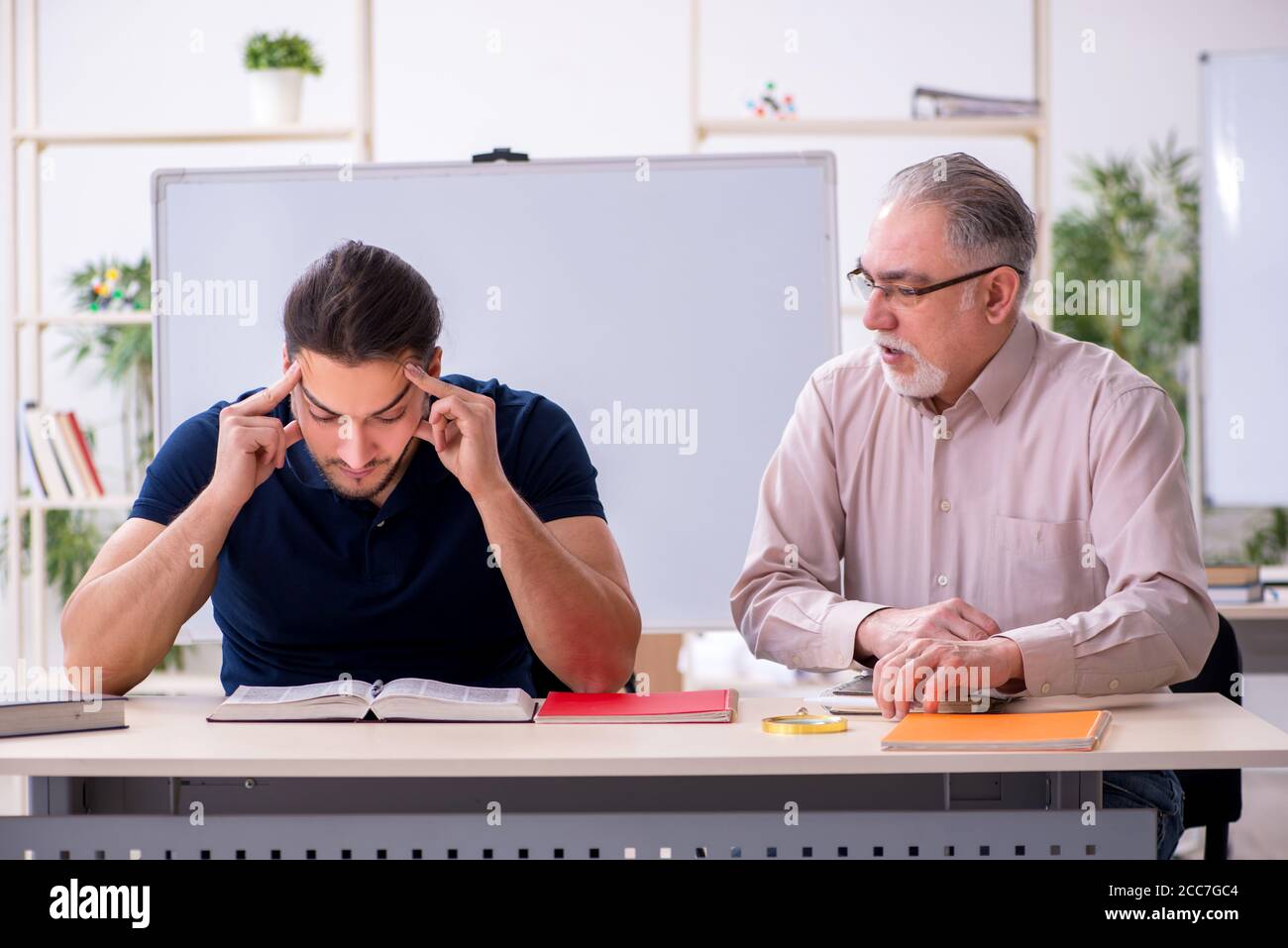 old-teacher-and-young-student-in-the-classroom-stock-photo-alamy