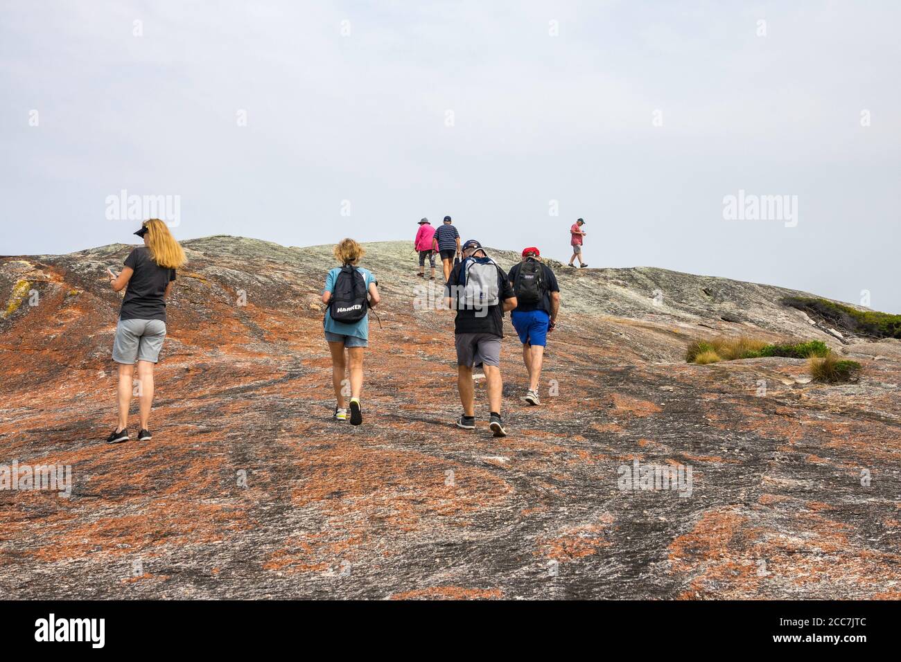 Hikers at Trousers Point, Flinders Island, Furneaux Group, Tasmania Stock Photo