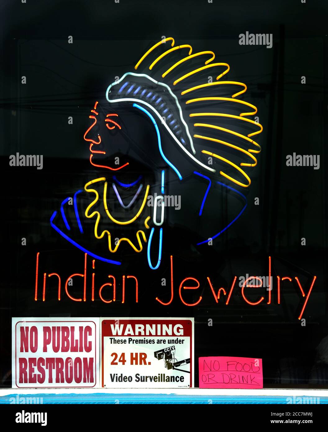 A neon sign of a Plains Indian chief in a Crescent City, California, shop selling Native-American arts and crafts. Stock Photo