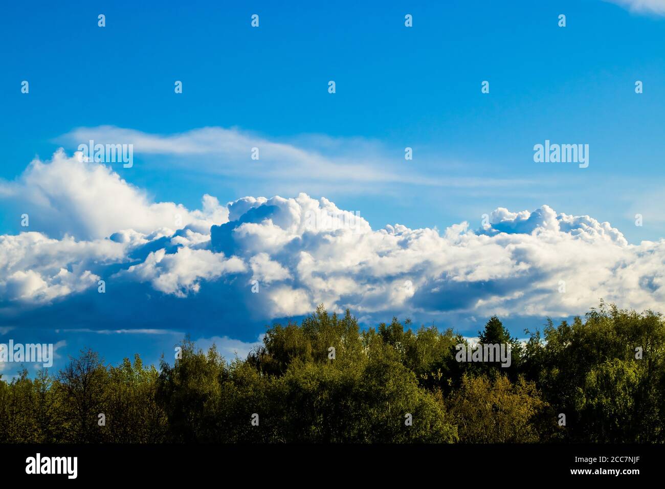 Beautiful landscape with fluffy white clouds on a blue sky. Cloudscape ...